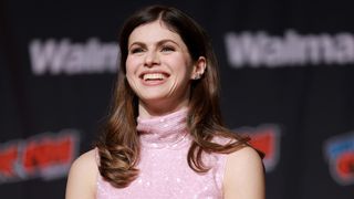 Alexandra Daddario in the pink sequined gown she wore for Mayfair Witches at NY Comic Con 2026.