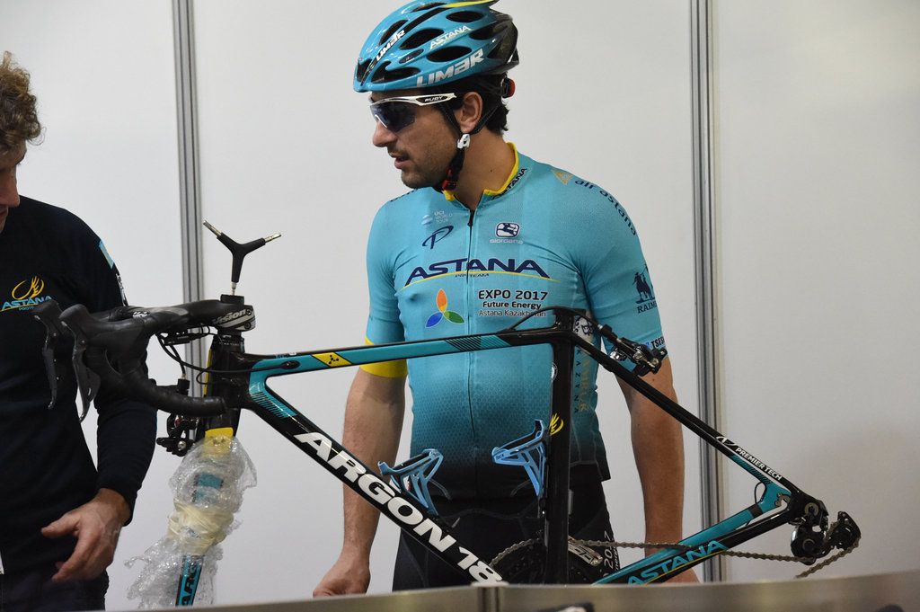 Oscar Gatto checks over his new race bike before the training ride