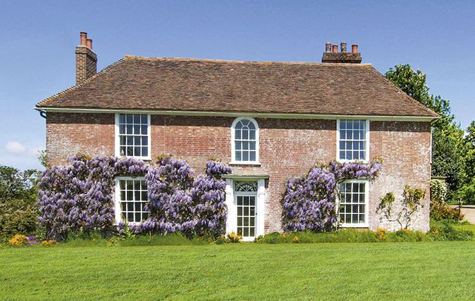 Meltingly beautiful Lodge House in Smeeth, near Ashford, Kent, has a Georgian façade clad in mature wisteria. £2.8 million through Strutt &amp;amp; Parker (01227 808744)