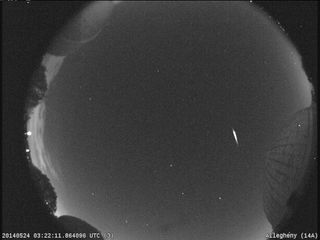 A brilliant meteor as bright as Jupiter streaks across the sky in this NASA all-sky camera view of the Camelopardalid meteor shower of early May 24, 2014. The meteor shower was created by dust from Comet 209P/LINEAR.