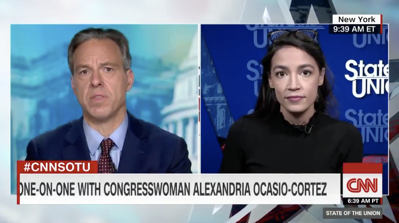 Jake Tapper and Alexandria Ocasio-Cortez.