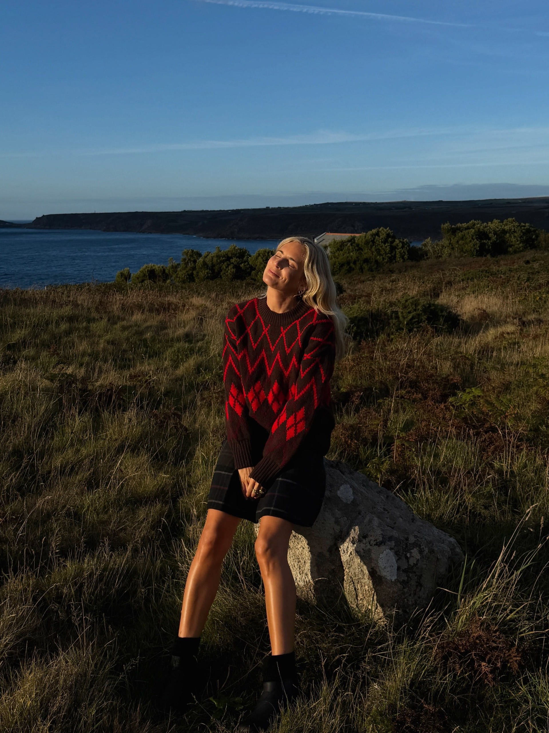 how to wear a kilt in 2026: lucy williams wears a knitted jumper, kilt skirt and ankle boots