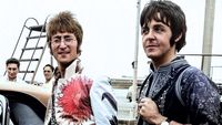 Paul McCartney and John Lennon arrive in England from Greek holiday wearing psychedelic clothes July 1967