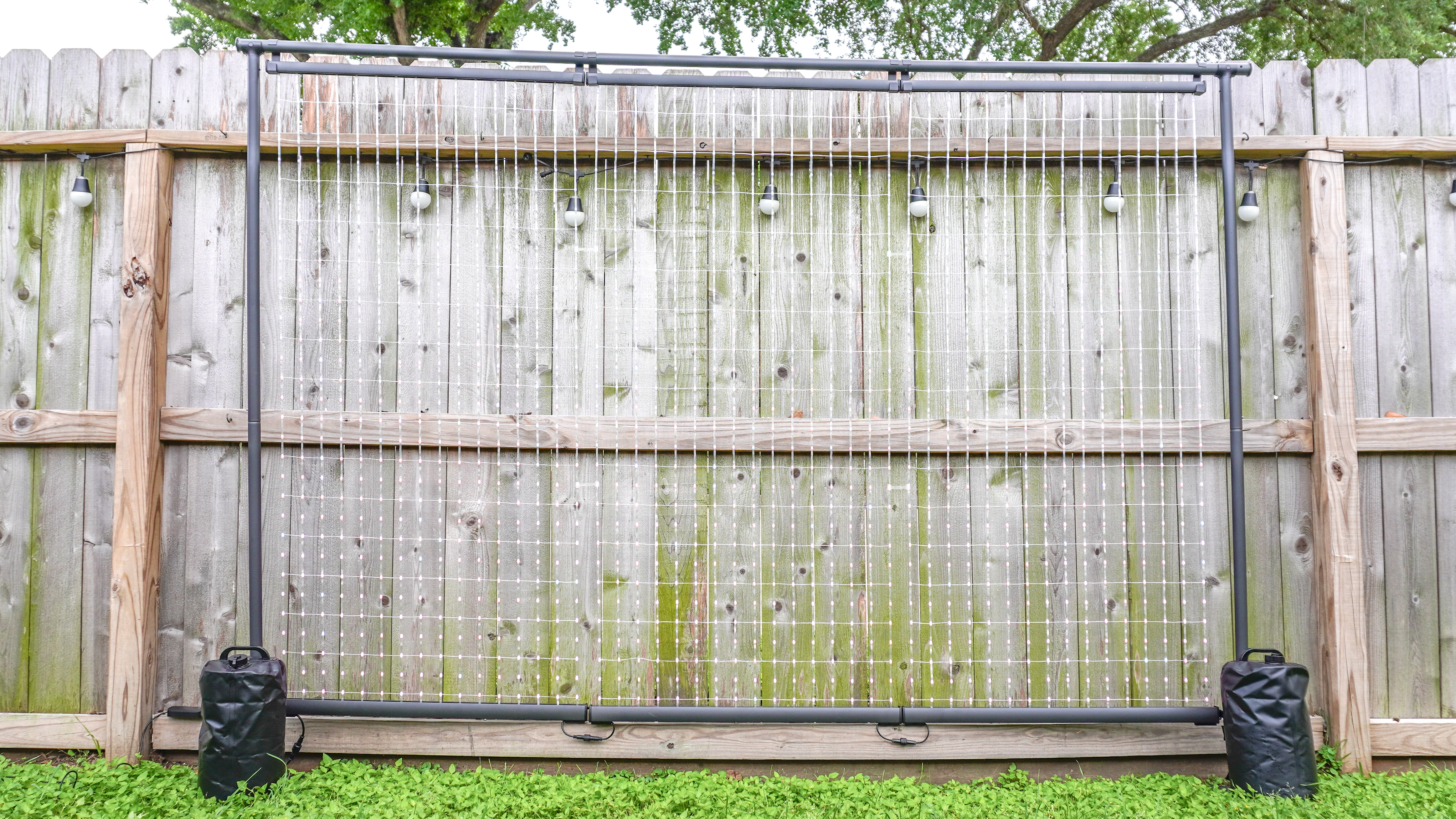 The Govee Lightwall set up outside and turned on with its LED lights barely visible