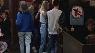 Two women playing an arcade game in Ferris Bueller's Day Off