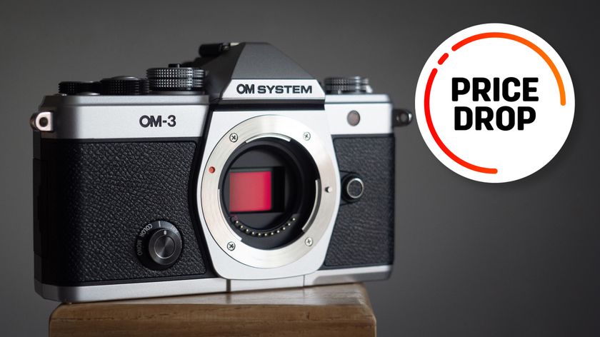 OM System OM-3 against a grey background with the text &quot;Price drop&quot;