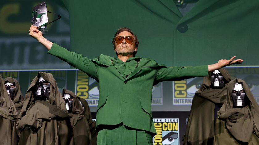 Robert Downey Jr wearing a green suit and sunglasses during Marvel&#039;s Hall H panel at San Diego Comic-Con 2024