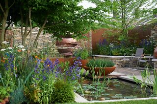 pond set into patio surrounded by plants