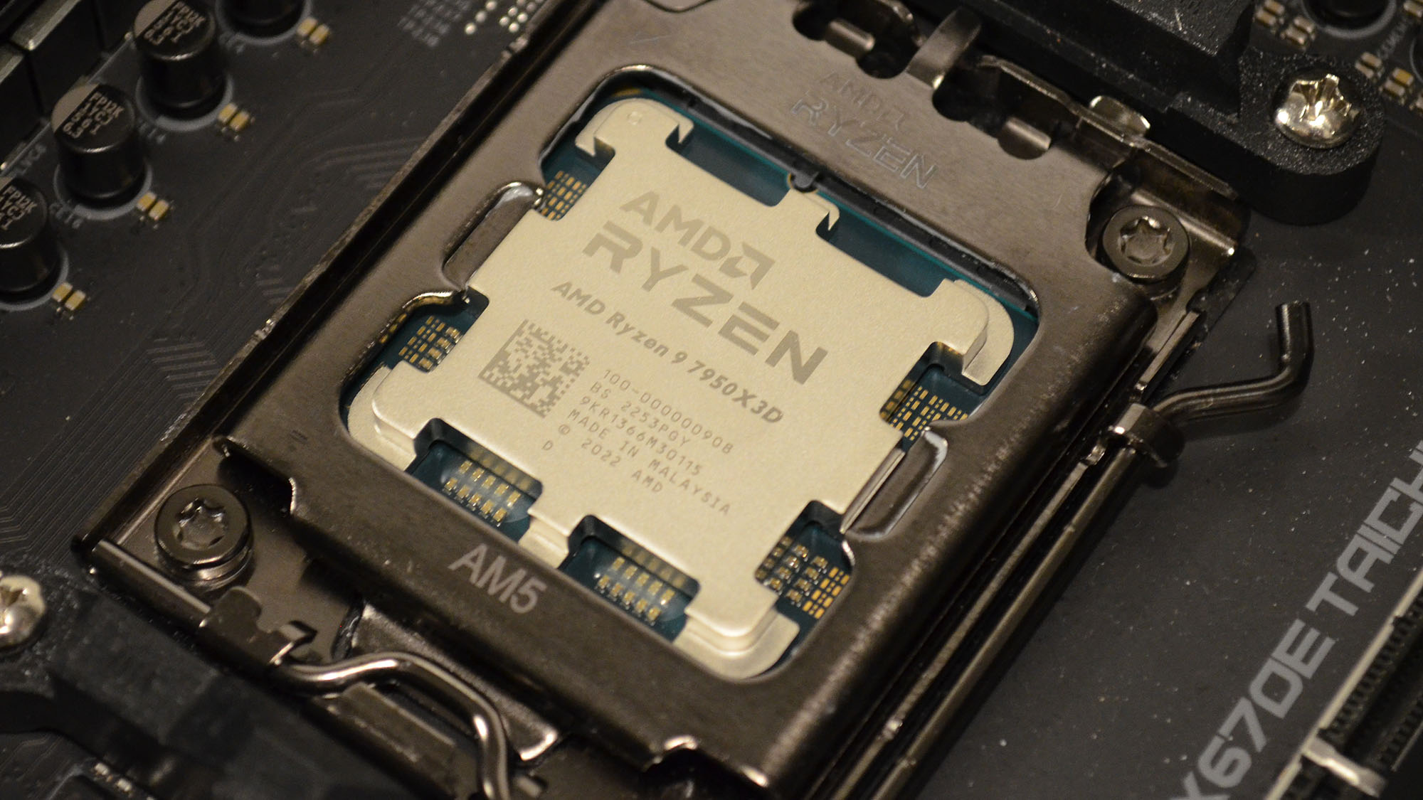 An AMD Ryzen 9 7950X3D sloted into a motherboard