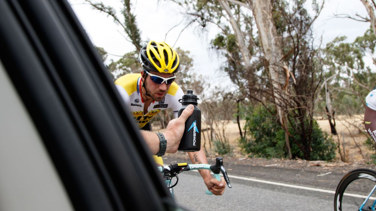 Time for a drink, riders from the break keep riding while our car was given permission to move up alongside them