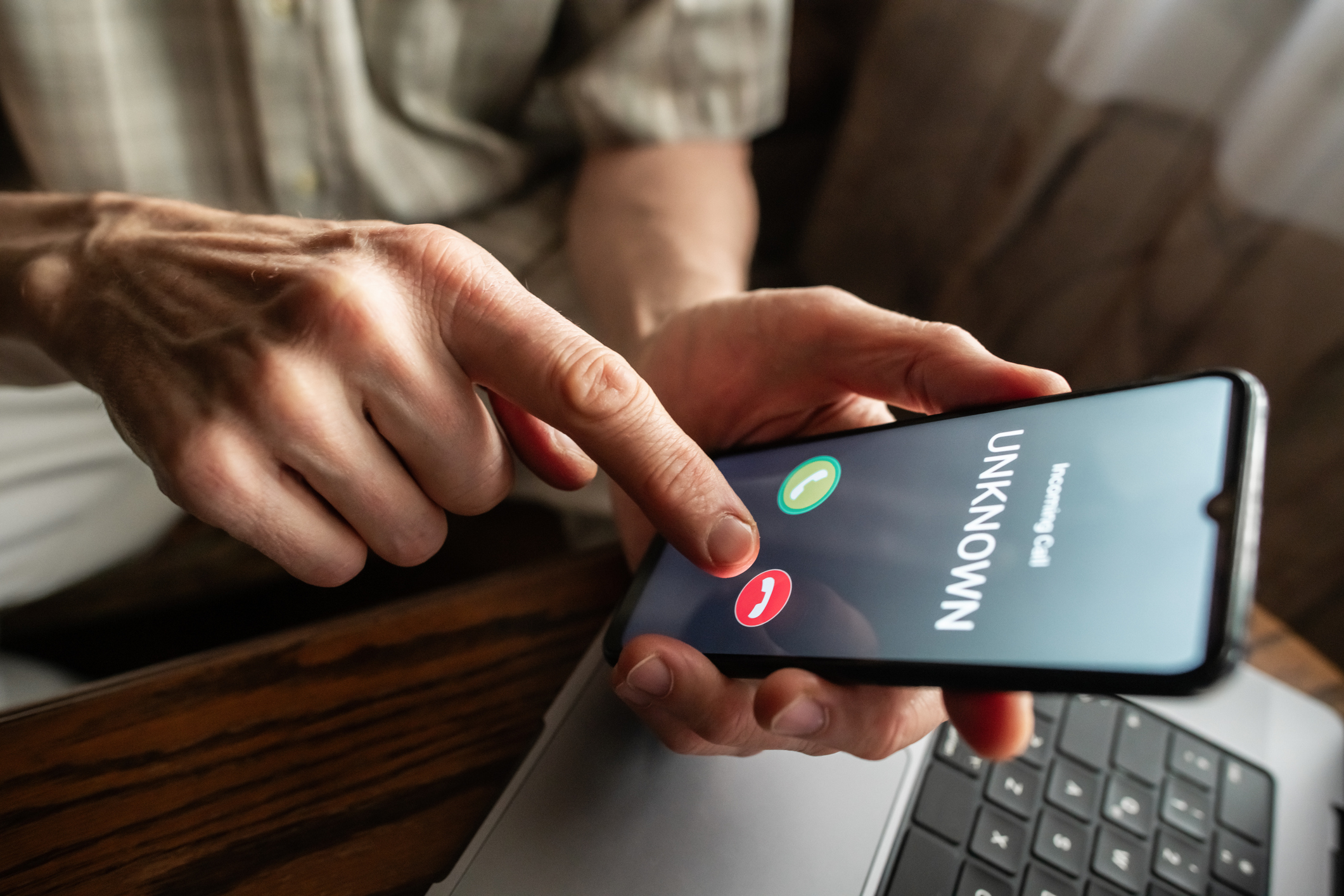 Someone holding a ringing mobile phone