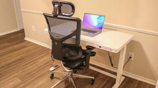 The X-Chair X2 pushed into the Flexipsot Comhar standing desk