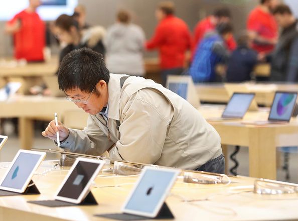 A Black Friday shopper visits an Apple Store.