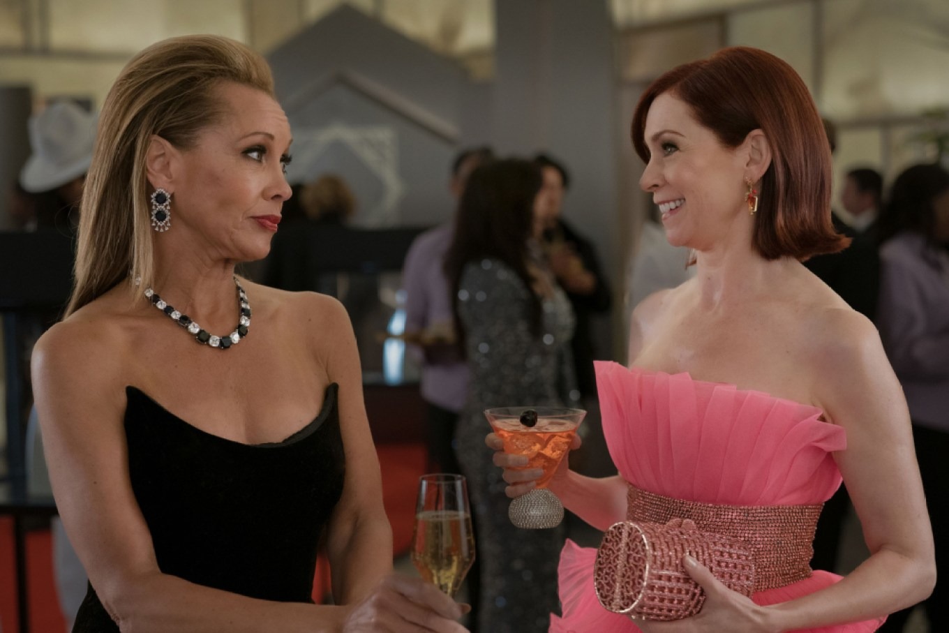 Vanessa Williams guest stars in &#039;Elsbeth&#039; in an episode in which she&#039;s at a formal event in a black dress talking to carrie preston as elspeth in a pink gown
