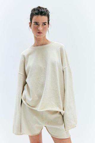 Sweater with rolled hem