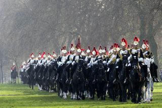 Members of the Household Cavalry Mounted Regiment parade on their horses during the Major General's inspection at Hyde Park in central London, on March 28, 2012 which they must pass to take part in state ceremonial activites in 2012. Soldiers from the iconic Household Cavalry Mounted Regiment will escort the Queen during her diamond jubilee procession on June 5 as well as other ceremonial duties during the London 2012 Olympic Games. AFP PHOTO / MIGUEL MEDINA (Photo credit should read MIGUEL MEDINA/AFP via Getty Images)