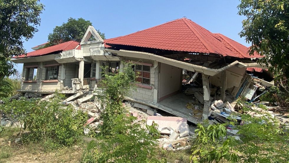 A house is seen split in half due to an earthquake