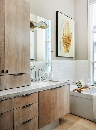 Small bathroom with wood cabinet storage