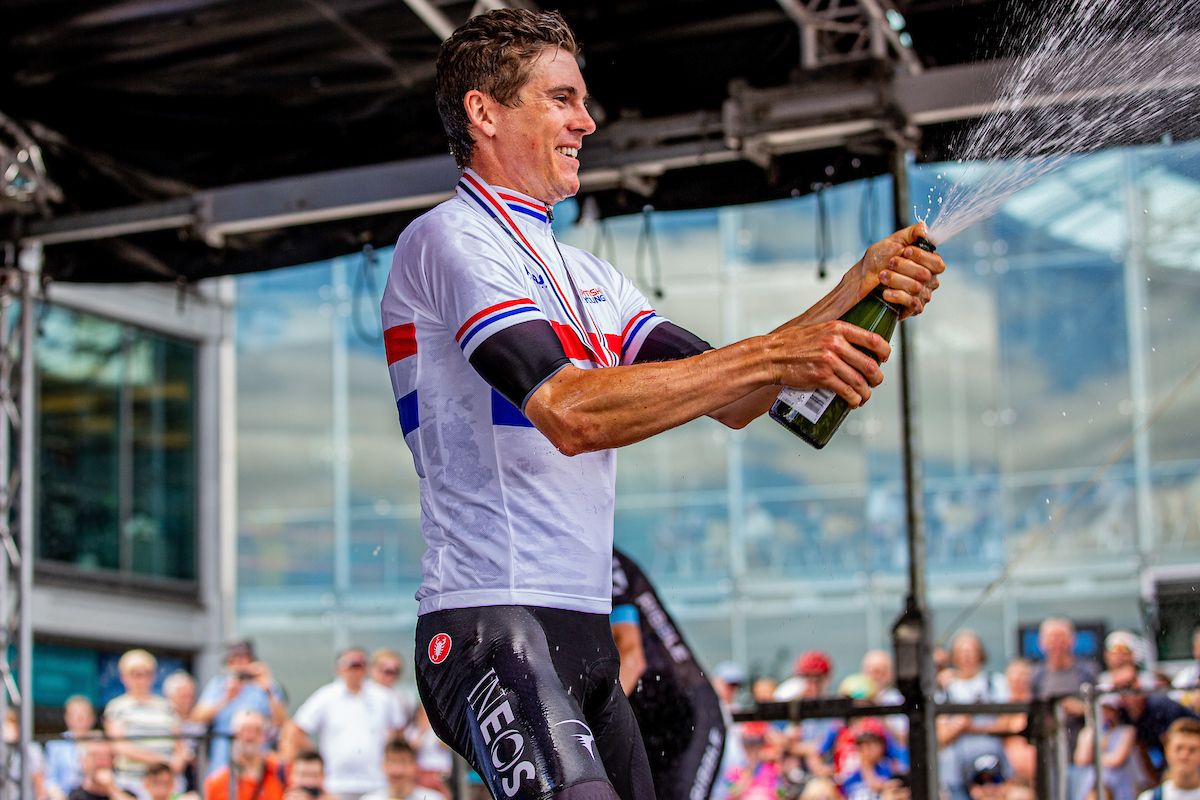 Ben Swift sprays the champagne on the podium