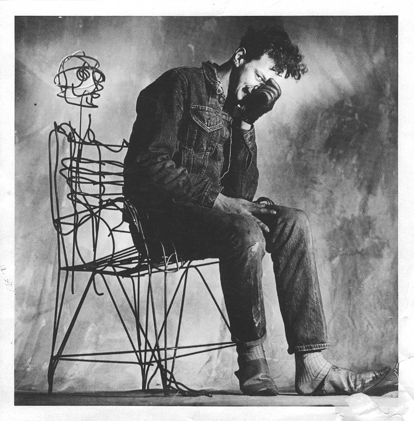 Tom Dixon as a young man with metal furniture he made