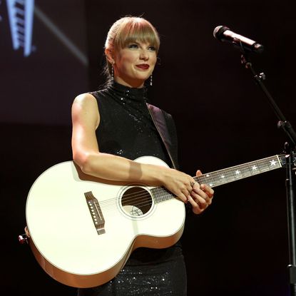 Taylor Swift on-stage at the NSAI 2022 Nashville songwriter Awards 