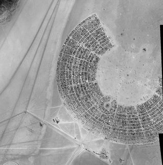This view, part of a 5-meter resolution mosaic of images acquired by the European Space Agency's Proba-1 satellite on Sept. 1, 2011, shows camper vans and tents at the Burning Man festival in Black Rock, Nev.