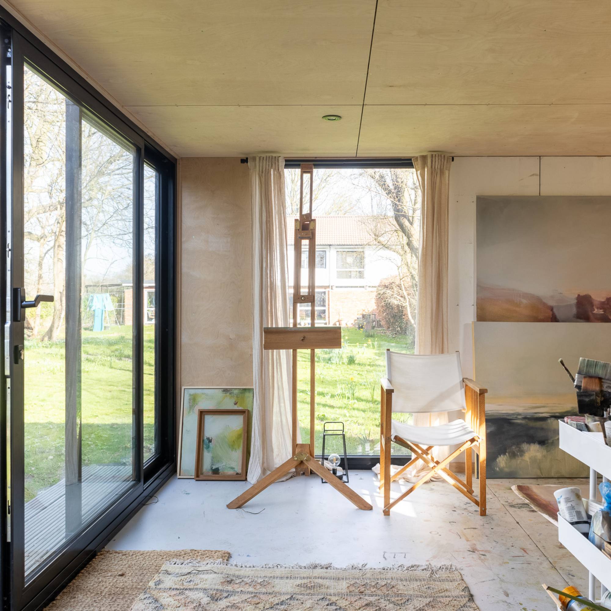 painting hobby area in garden room with view of lawn