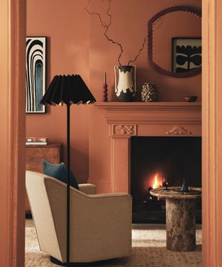 Terracotta living room with a cozy fireplace