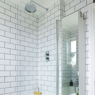 white tiles walled shower area