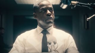 Sterling K Brown sits with a look of confusion in an interrogation room in Paradise S1.