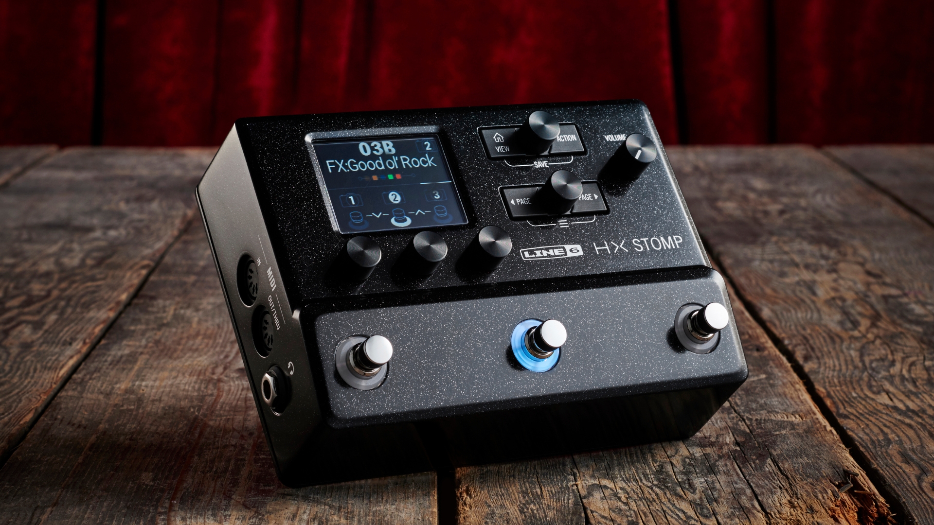 A Line 6 HX Stomp pedal amp on a wooden floor