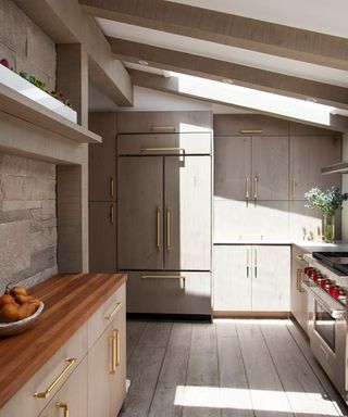 neutral kitchen with gray cabinets and wooden tiles on the floor and walls