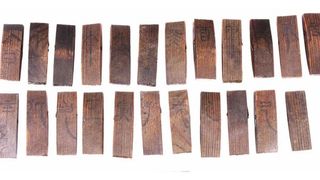 Wooden slips marked with Chinese characters that relate to the traditional Tiangan Dizhi astronomical calendar.