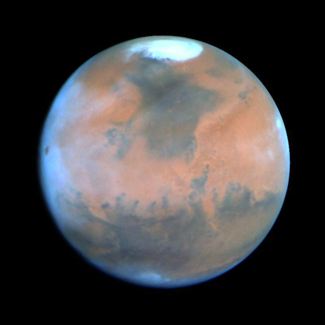 Mars, the Red Planet, as seen from the Hubble Space Telescope.