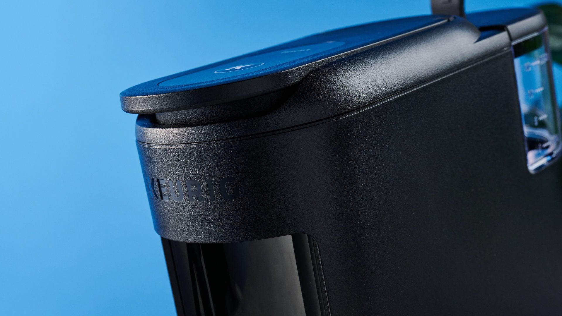 the keurig k-mini mate coffee maker photographed with the blue tom's guide background