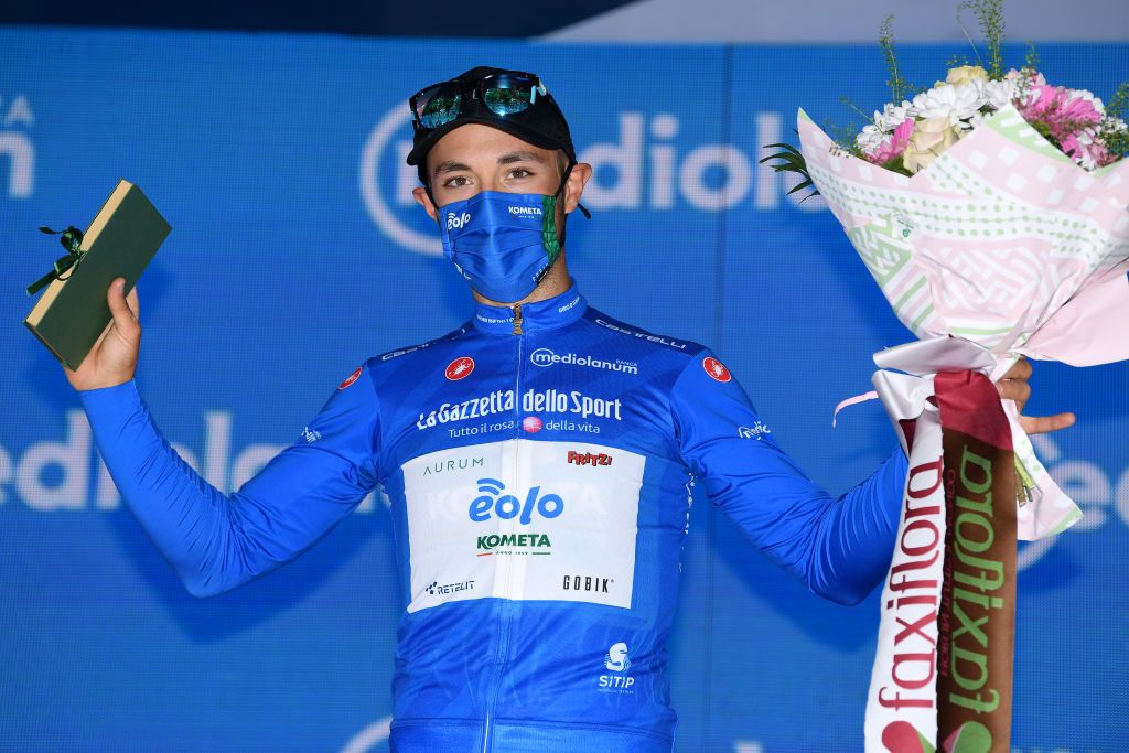 NOVARA ITALY MAY 09 Vincenzo Albanese of Italy and EOLOKOMETA Cycling Team blue mountain jersey celebrates at podium during the 104th Giro dItalia 2021 Stage 2 a 179km stage from Stupinigi Nichelino to Novara Mask Covid safety measures girodiitalia Giro UCIworldtour on May 09 2021 in Novara Italy Photo by Tim de WaeleGetty Images