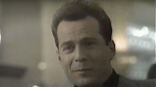 Bruce Willis sporting a smirk in Seagram's Coolers ad