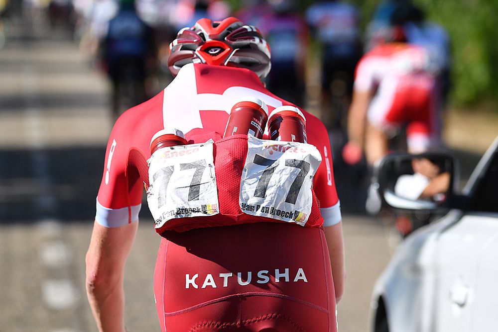 Katusha collects bottles for a feed