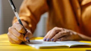 Woman planning in a diary