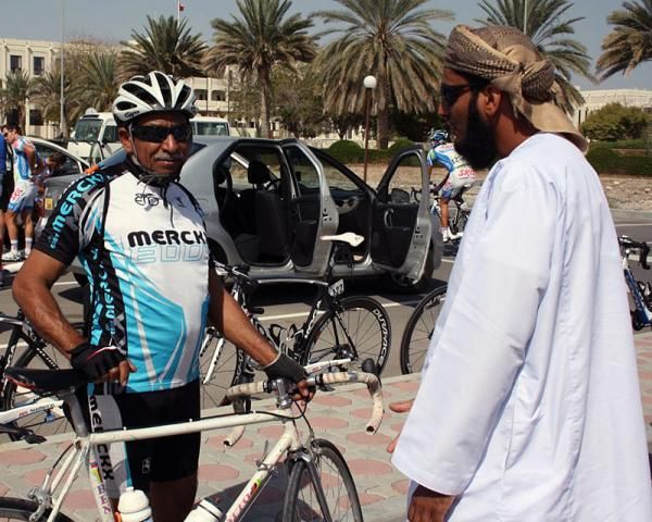 There are a few bike riders in Oman.