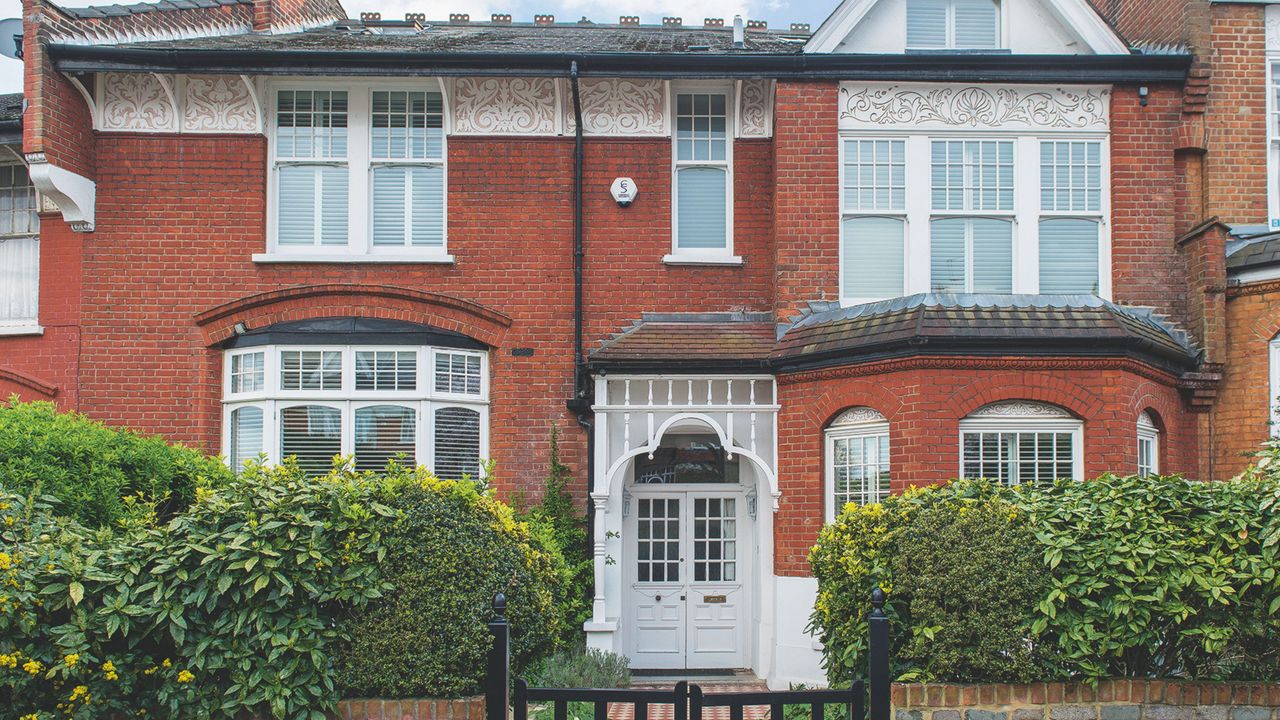 Exterior of the Edwardian terrace of the Muswell Hill house, garden gate and path to the front door.