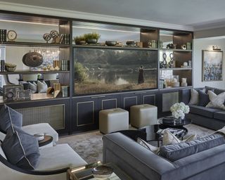 Grey sofas have been chosen here to create a relaxing and stylish living room unit that looks onto the media unit