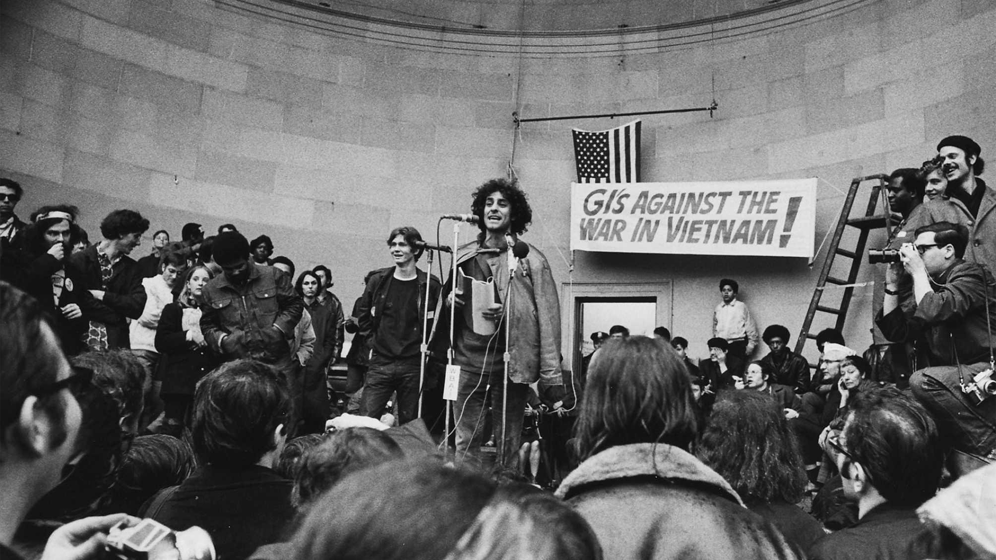 Yippie leader Abbie Hoffman talks to assembled peace marchers at bandshell in Central Park in Manhattan during peace rally on April 5, 1969.