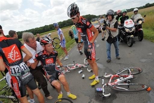 JJ Rojas (Caisse d'Epargne) is helped up off the ground after crashing on stage 11.