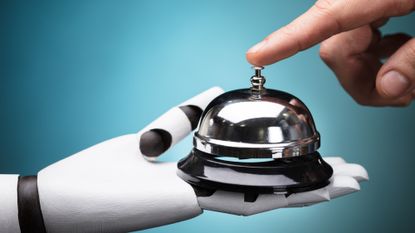 A robotic hand holds a service bell