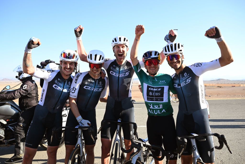 ALULA CAMEL CUP TRACK SAUDI ARABIA FEBRUARY 01 LR Xabier Azparren Irurzun of Spain stage winner Matteo Moschetti of Italy Frederik Frison of Belgium overall race winner Tom Pidcock of The United Kingdom Green Leader Jersey and Nicolo Parisini of Italy and Q365 Pro Cycling Team react after the 5th AlUla Tour 2025 Stage 5 a 1696km stage from AlUla Camel Cup Track to AlUla Camel Cup Track on February 01 2025 in AlUla Saudi Arabia Photo by Szymon GruchalskiGetty Images
