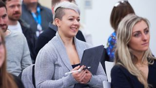 woman at a talk with an ipad