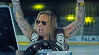 Vince Neil in a screengrab from the Dollar Loan Center ad