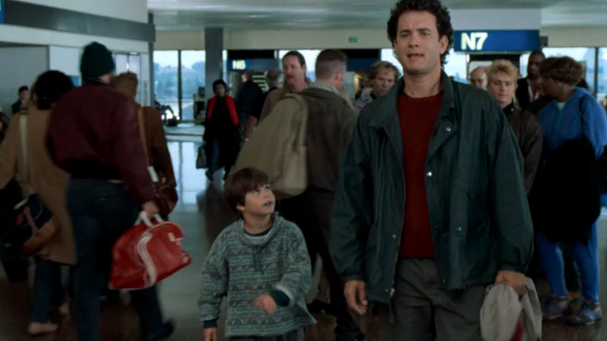 Sam and Jonah walking through the airport in Sleepless in Seattle