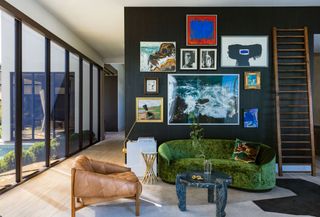 a modern living room with a gallery wall